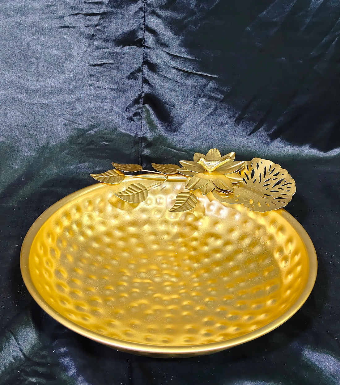 metal urli with hammered and bird nest